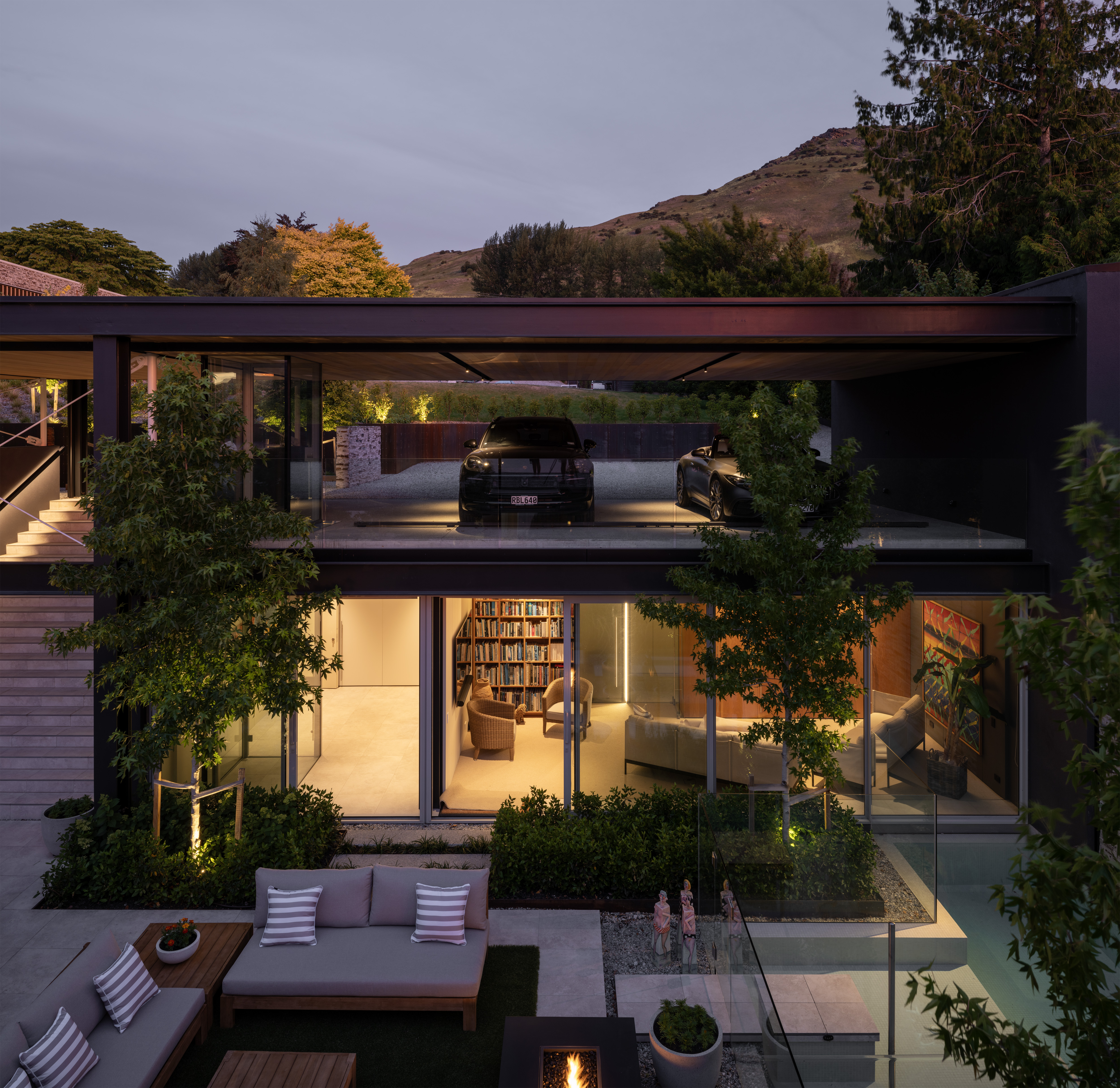 M1H3BCMH7L4LVHV_Courtyard_House_courtyard_towards_carport__pool_sitting_at_night_Simon_Devitt_6.jpg